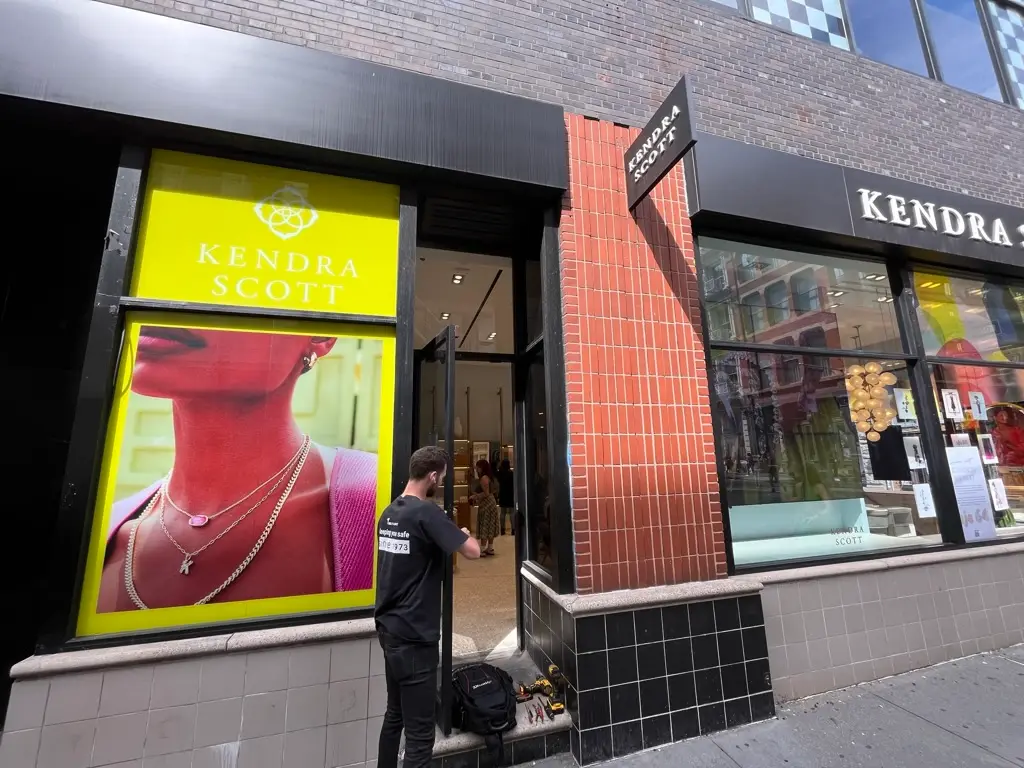 Locksmith servicing a Brooklyn storefront entrance
